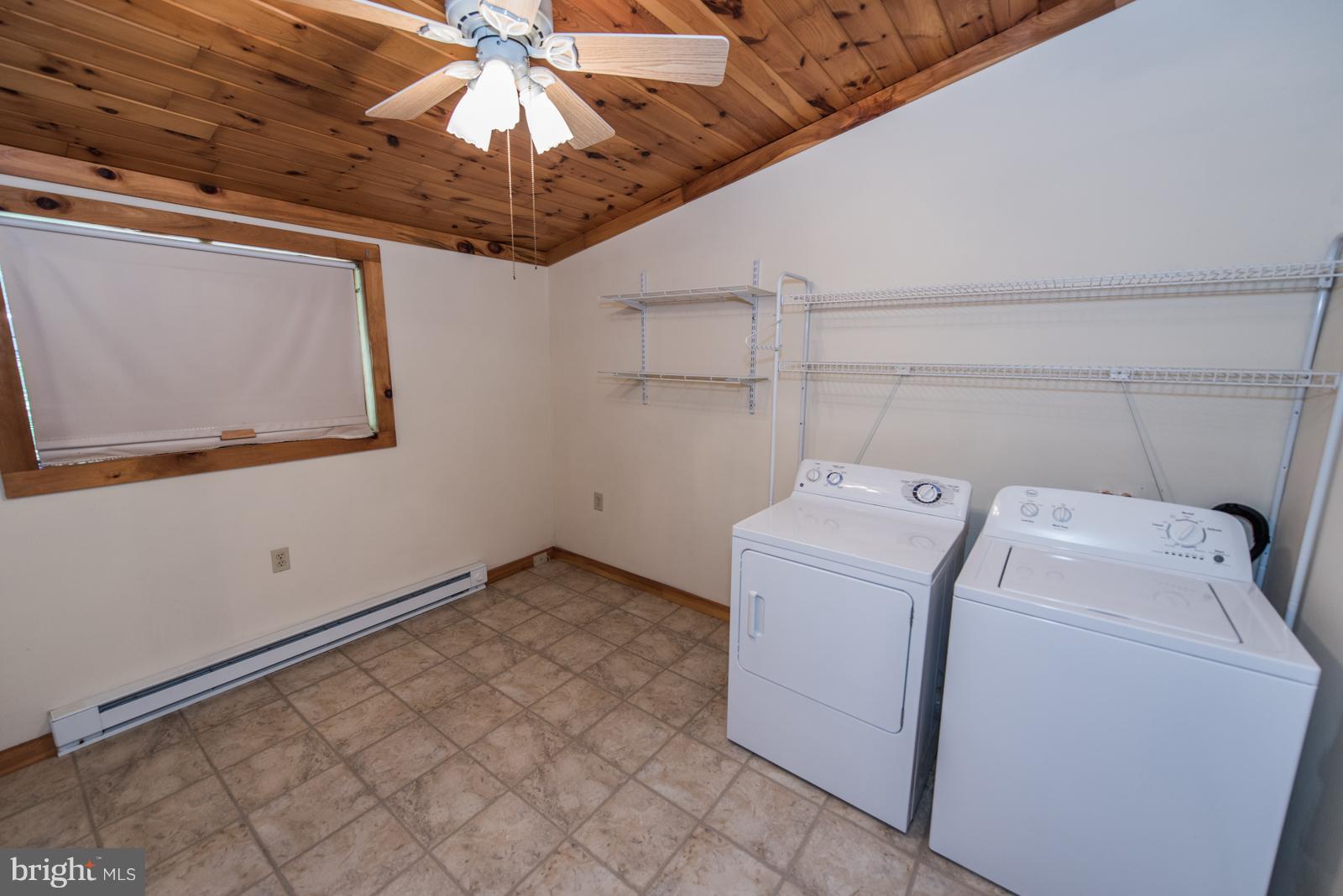 116 Hickory Hollow Road Berkeley Springs, WV 25411 - Photo 23 of 30 a utility room with dryer and washer