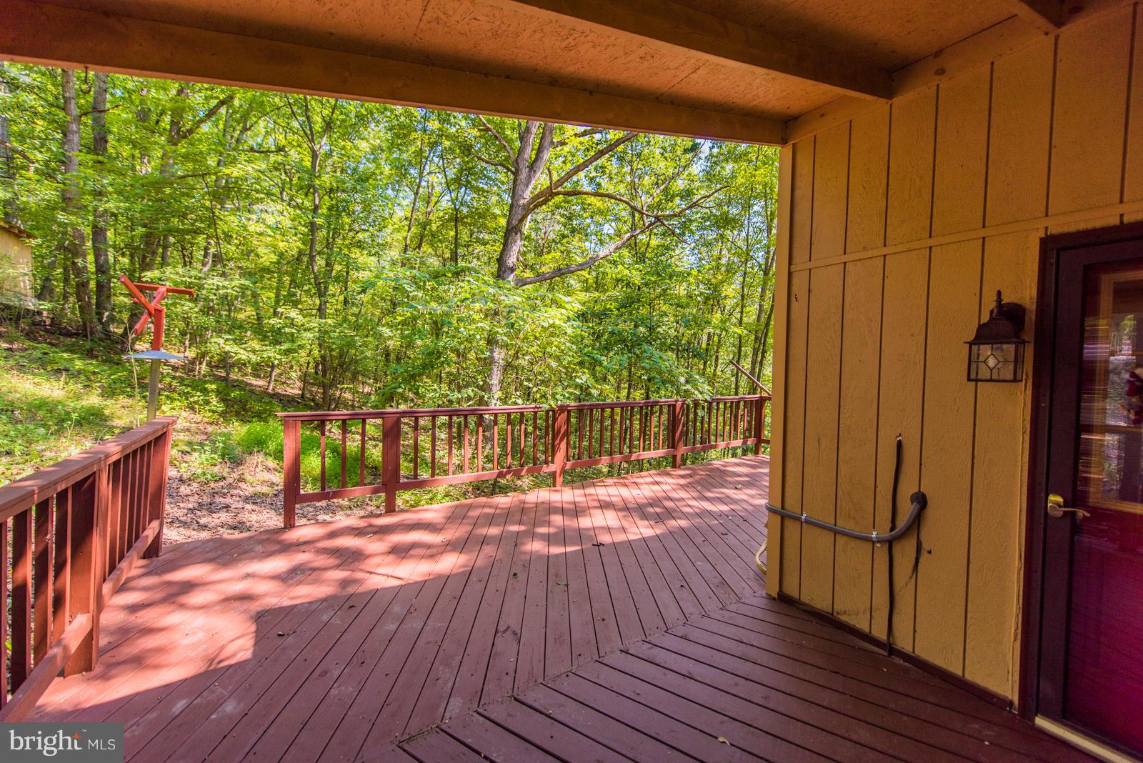 116 Hickory Hollow Road Berkeley Springs, WV 25411 - Photo 27 of 30 a view of deck with wooden floor and outdoor space