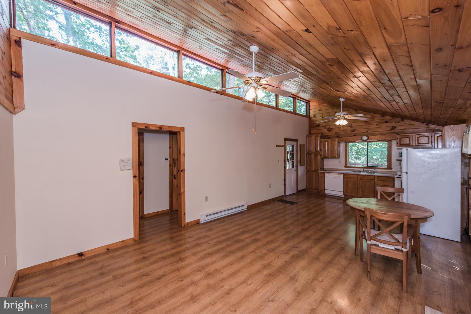 116 Hickory Hollow Road Berkeley Springs, WV 25411 - Photo 5 of 30 a view of a livingroom with furniture and a window