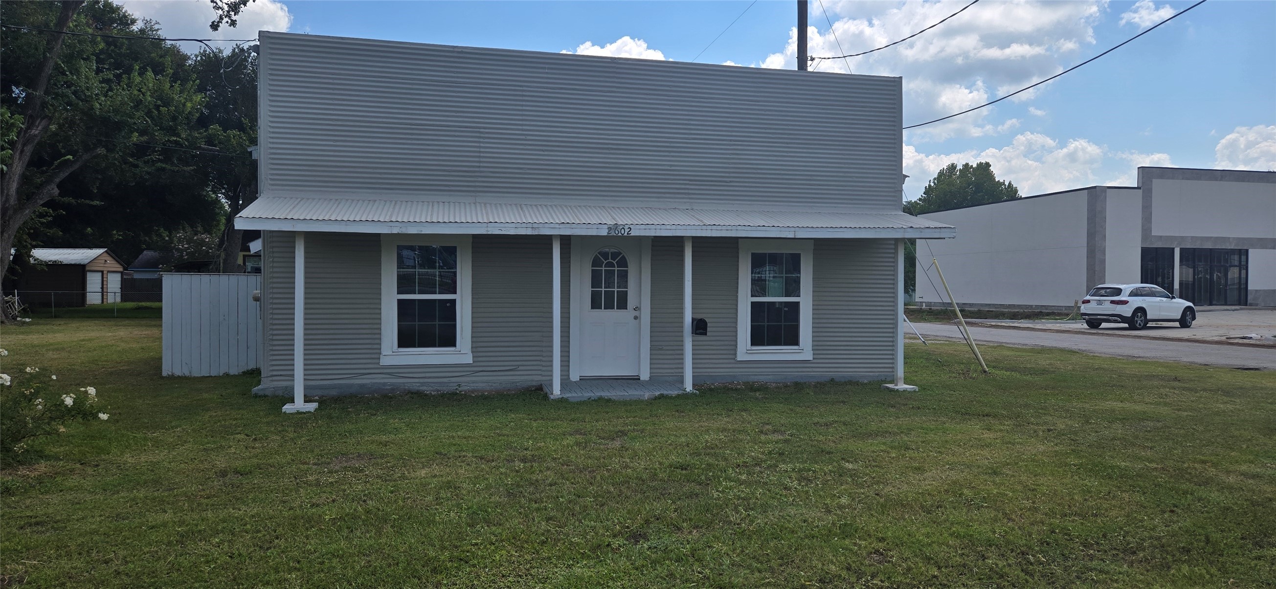 2602 North Richmond Road Wharton, TX 77488 - Photo 1 of 11 a backyard of a house with yard table and chairs