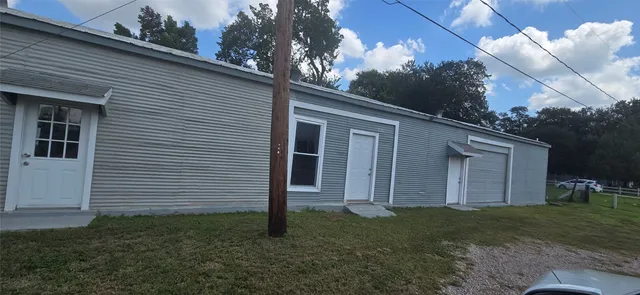 a view of a back yard of the house