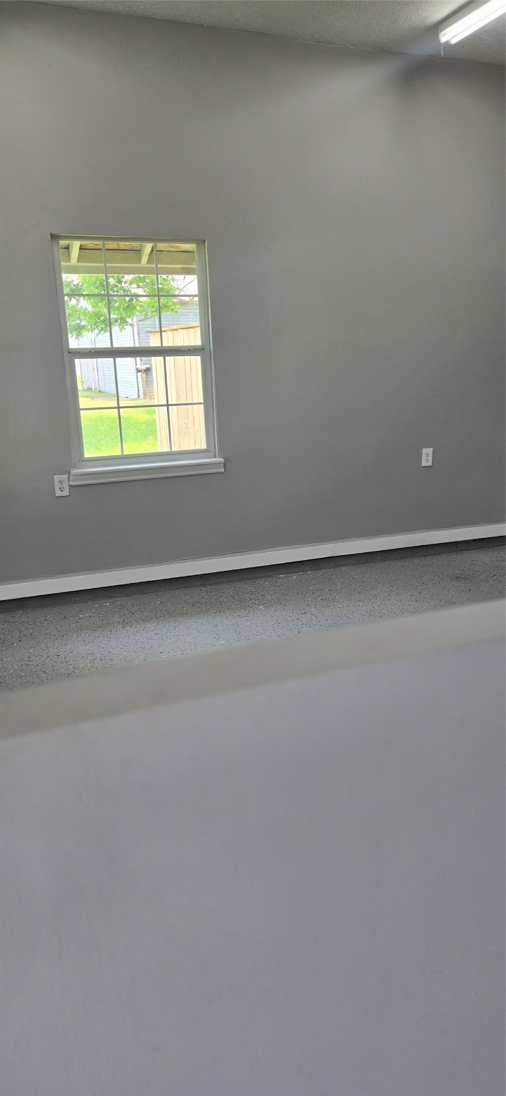 2602 North Richmond Road Wharton, TX 77488 - Photo 9 of 11 a view of an empty room with a window