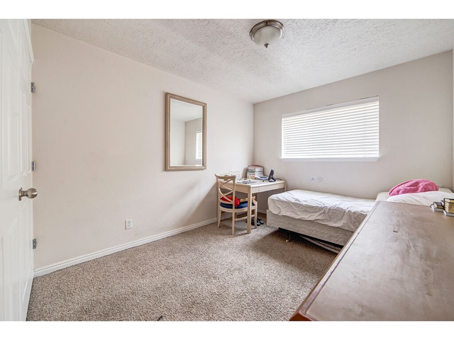 865 North 500 West, Unit 5 Provo, UT 84604 - Photo 7 of 14 Bedroom featuring a neutral color palette, wall-to-wall carpeting, and a window with horizontal blinds