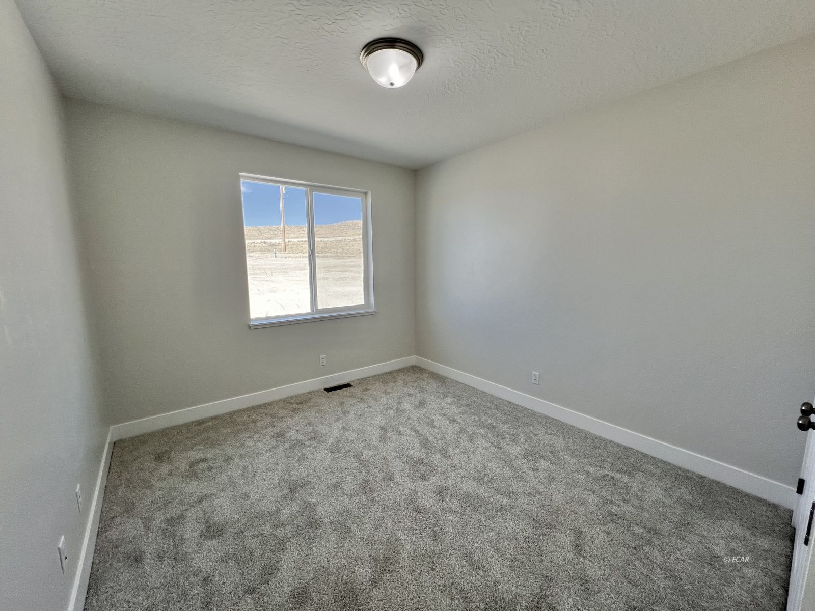 518 Ridgeway Drive Spring Creek, NV 89815 - Photo 17 of 37 an empty room with a empty space and windows