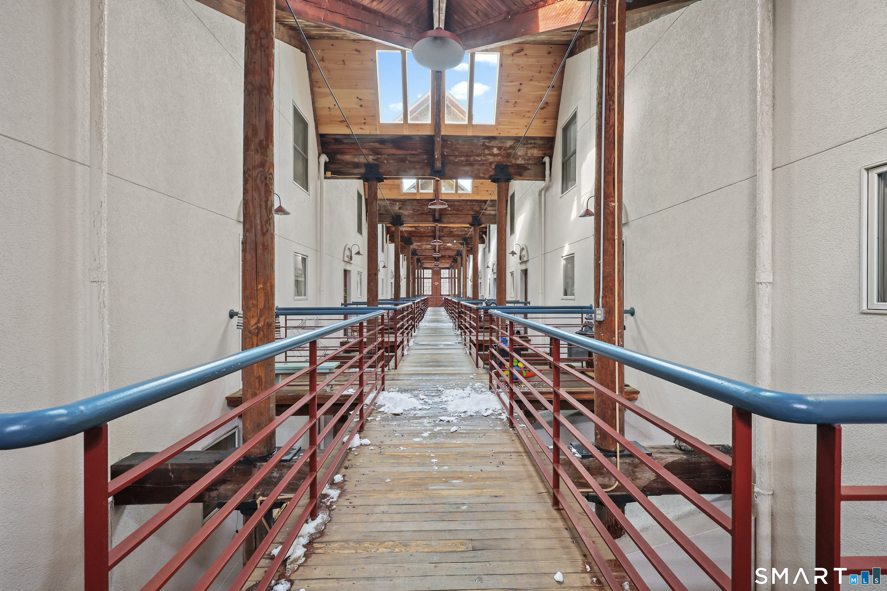 839 Main Street, Unit 78 Torrington, CT 06790 - Photo 26 of 57 a view of balcony with wooden floor and stairs
