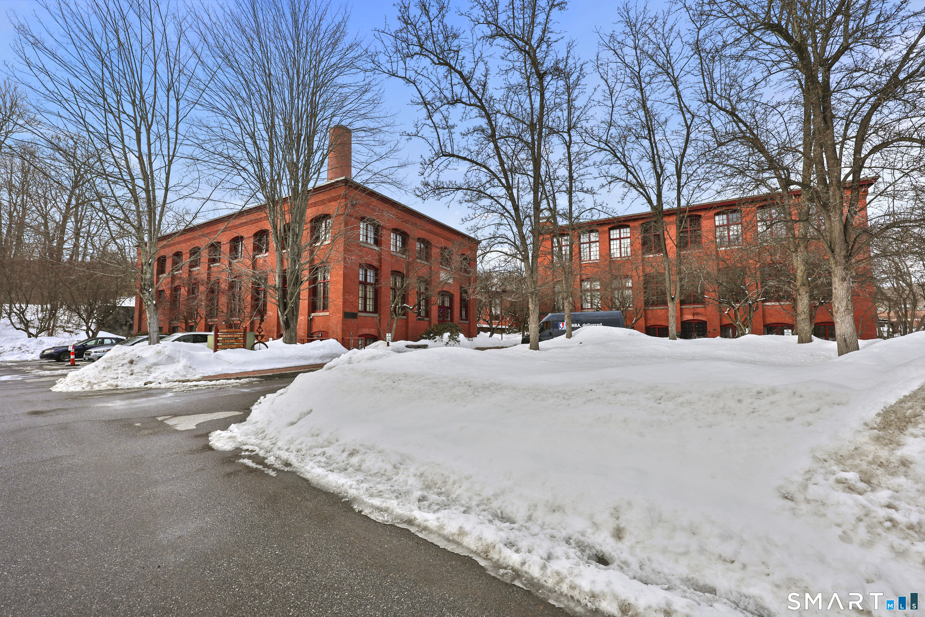 839 Main Street, Unit 78 Torrington, CT 06790 - Photo 40 of 57 a street view with large trees