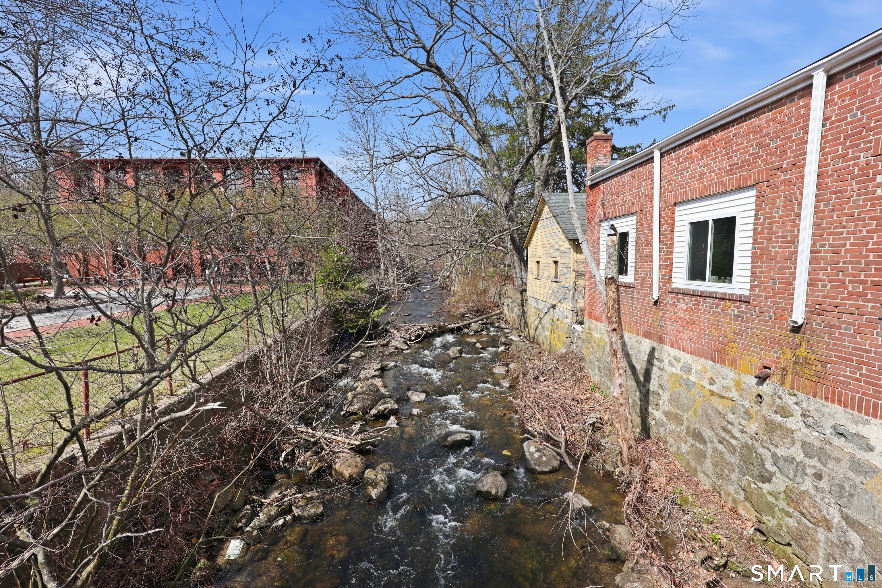 839 Main Street, Unit 78 Torrington, CT 06790 - Photo 43 of 57 a backyard of a house with lots of green space