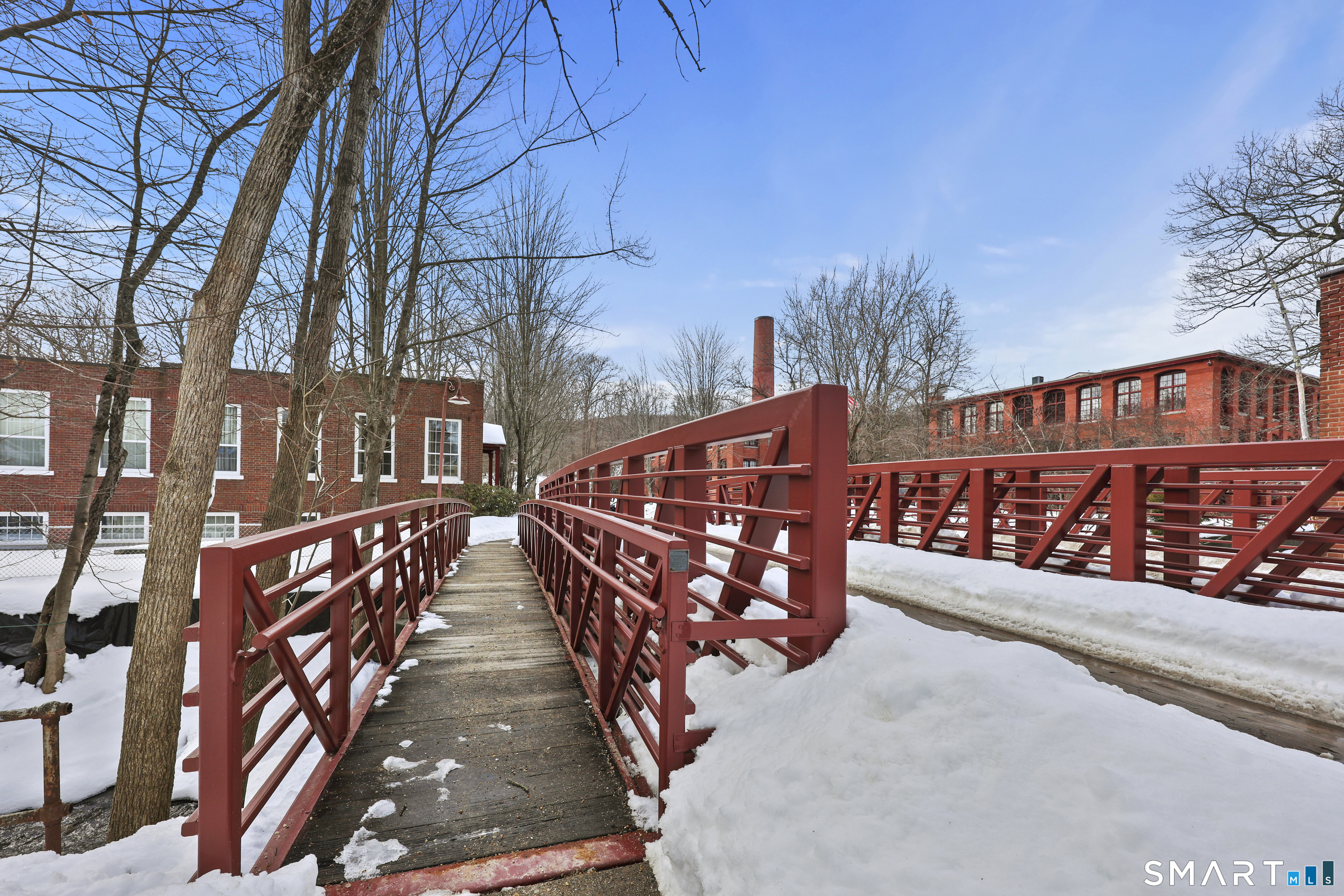 839 Main Street, Unit 78 Torrington, CT 06790 - Photo 44 of 57 a view of wooden house with a street from a balcony