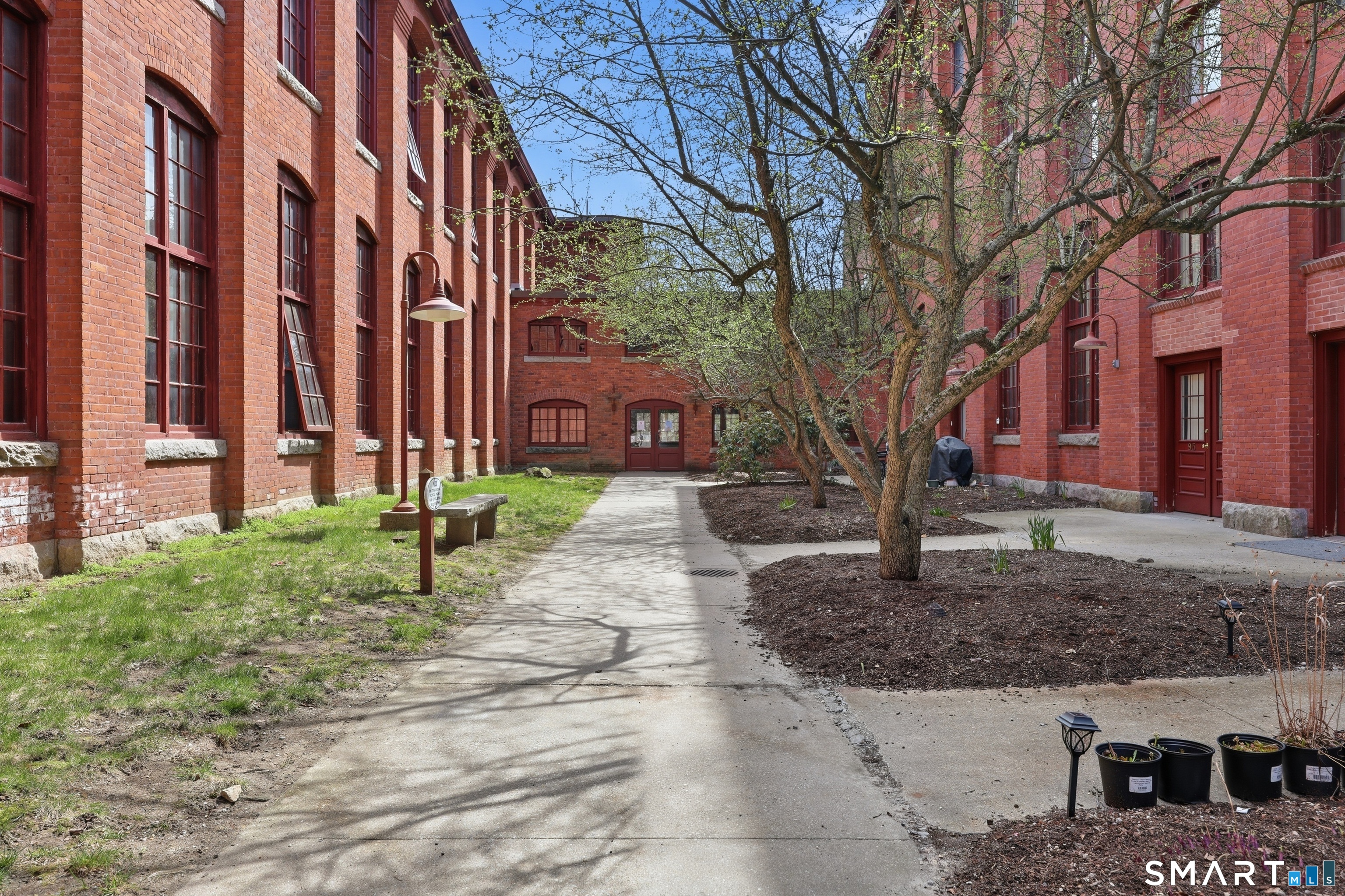 839 Main Street, Unit 78 Torrington, CT 06790 - Photo 47 of 57 a view of a building with a yard