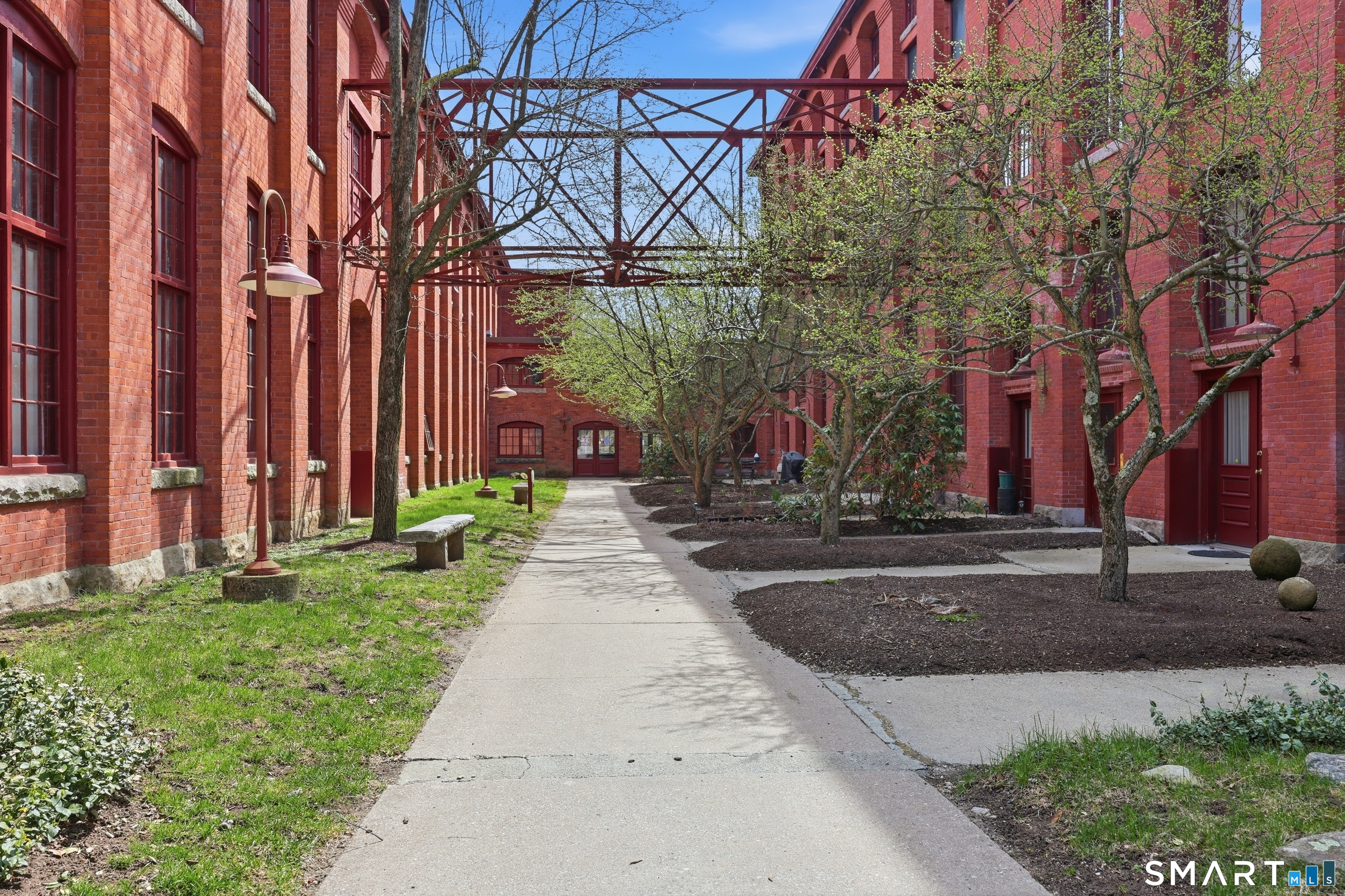 839 Main Street, Unit 78 Torrington, CT 06790 - Photo 50 of 57 a front view of a building with a yard