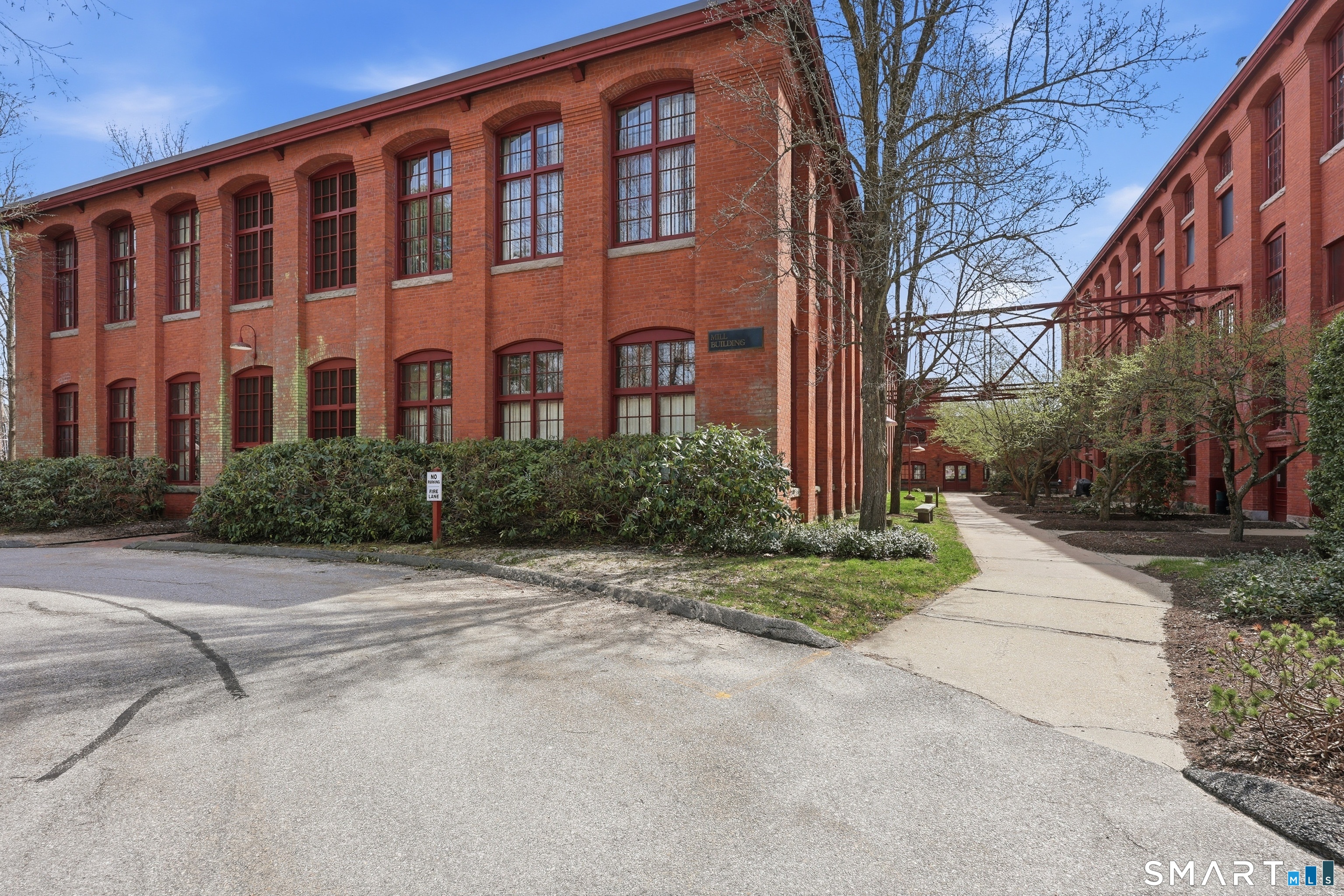 839 Main Street, Unit 78 Torrington, CT 06790 - Photo 52 of 57 a front view of a building with garden