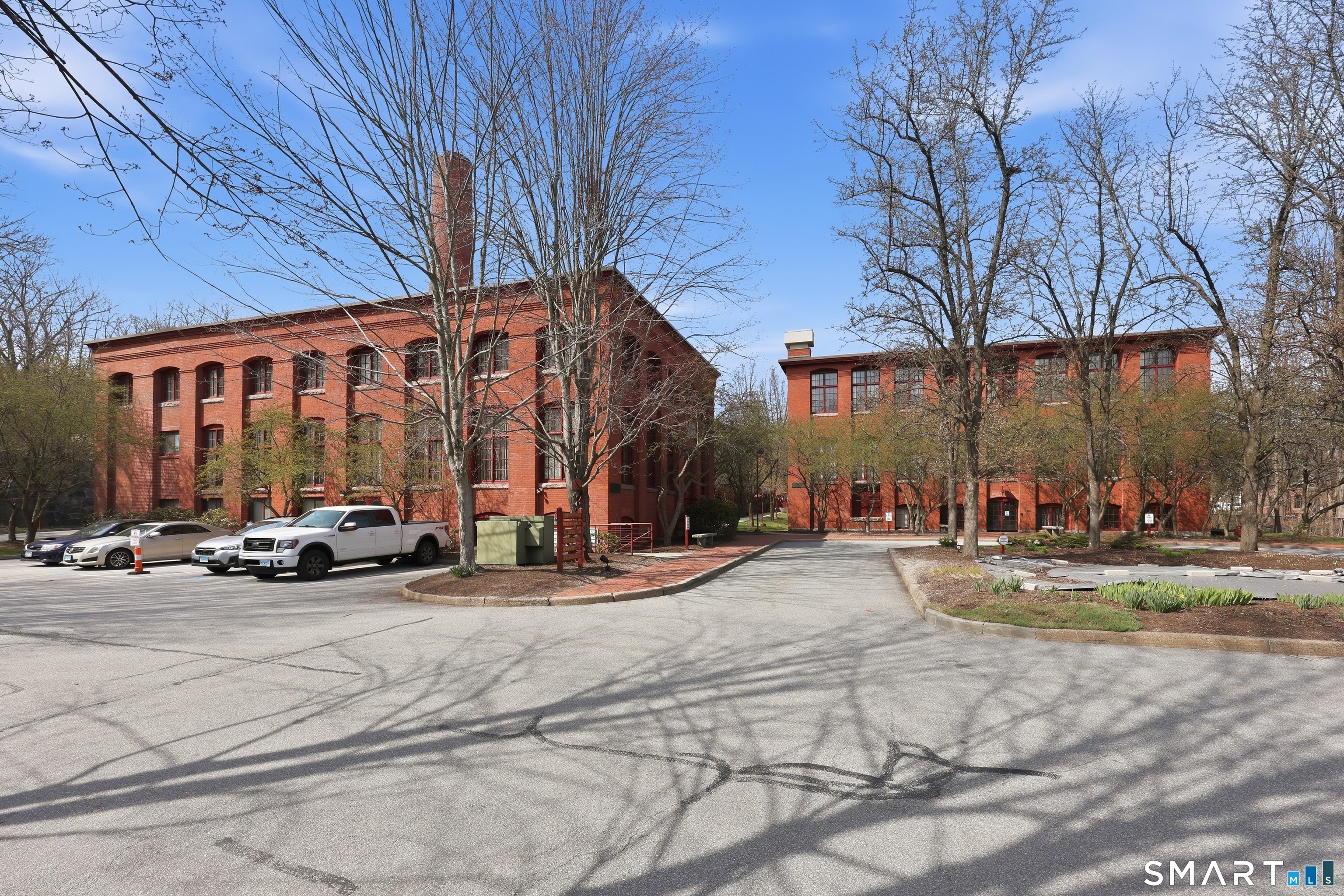 839 Main Street, Unit 78 Torrington, CT 06790 - Photo 54 of 57 a view of a parked cars in front of a building