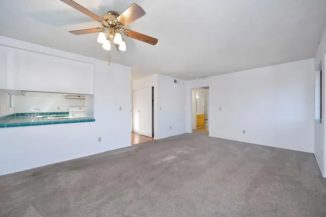 a view of a room with an empty shelves