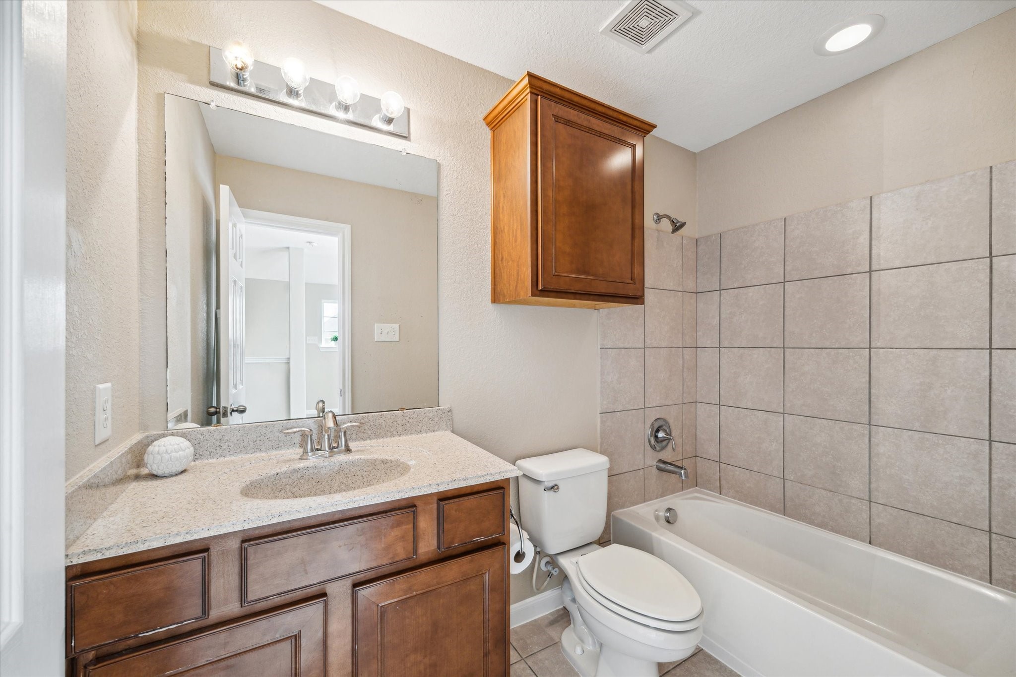 9015 Springcroft Court Tomball, TX 77375 - Photo 32 of 35 a bathroom with a sink toilet vanity and bathtub
