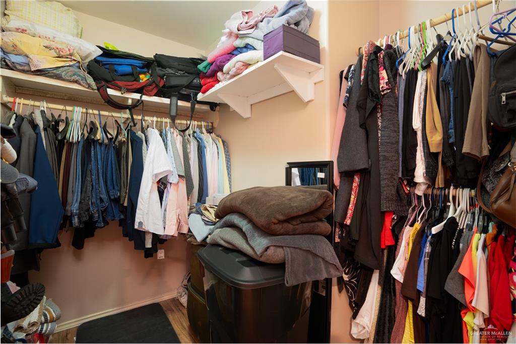 24609 Ocean Street Monte Alto, TX 78538 - Photo 12 of 31 a view of walk in closet with clothes and shoes