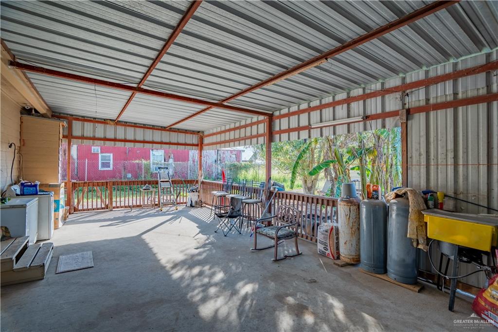 24609 Ocean Street Monte Alto, TX 78538 - Photo 17 of 31 a living room with furniture and a flat screen tv