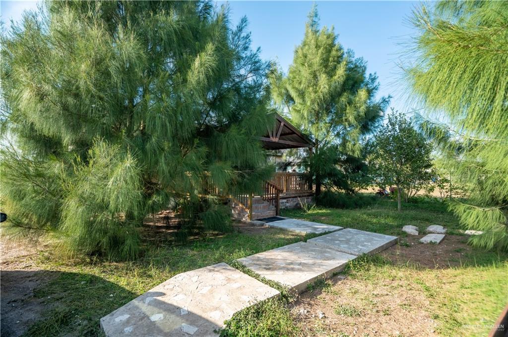 24609 Ocean Street Monte Alto, TX 78538 - Photo 19 of 31 a view of a backyard with a garden