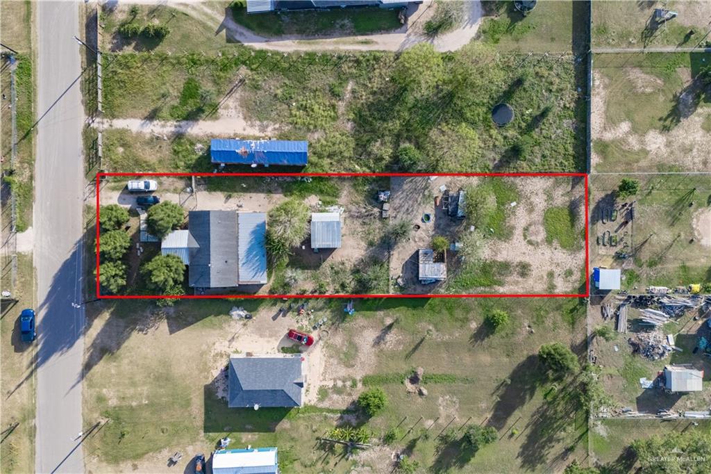 24609 Ocean Street Monte Alto, TX 78538 - Photo 25 of 31 an aerial view of a house with a garden and plants