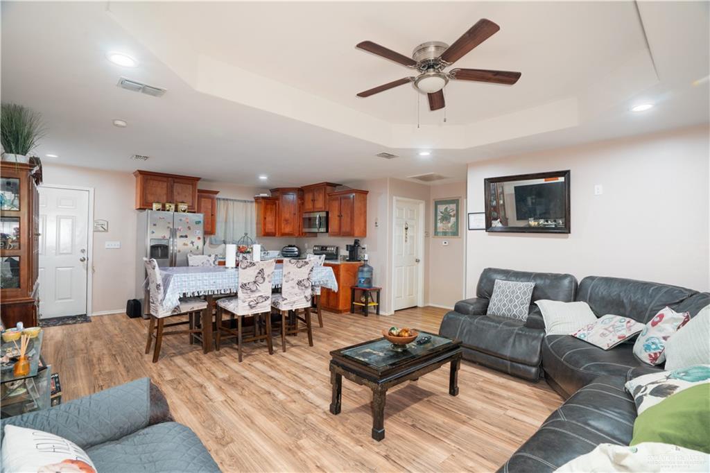24609 Ocean Street Monte Alto, TX 78538 - Photo 8 of 31 a living room with furniture and a wooden floor