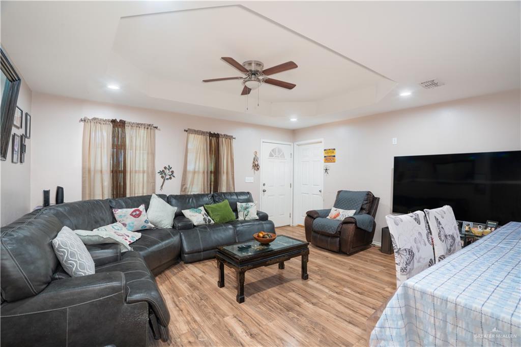 24609 Ocean Street Monte Alto, TX 78538 - Photo 9 of 31 a living room with furniture and a flat screen tv