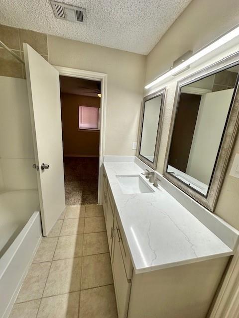 4119 Spring Meadow Lane Flower Mound, TX 75028 - Photo 19 of 28 a en suite bathroom with a granite countertop sink