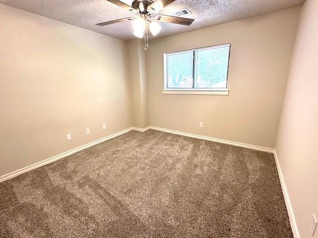 4119 Spring Meadow Lane Flower Mound, TX 75028 - Photo 22 of 28 an empty room with windows and fan