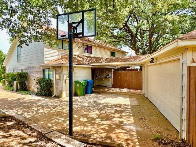 4119 Spring Meadow Lane Flower Mound, TX 75028 - Photo 23 of 28 a view of a house with a tree in the background