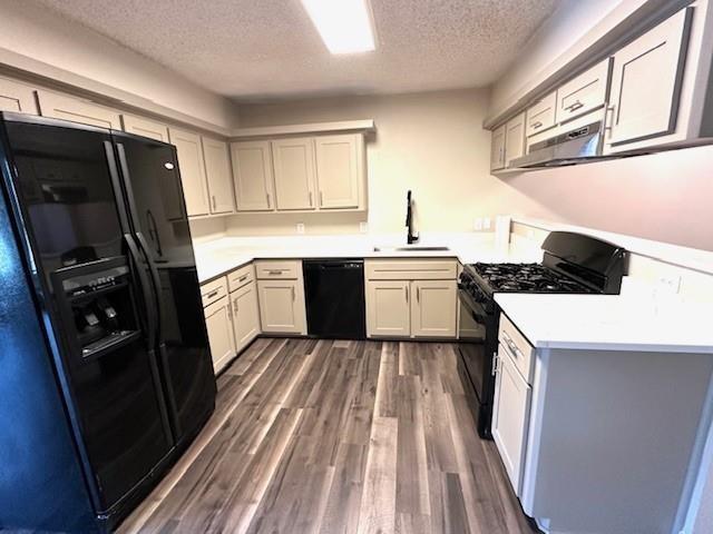 4119 Spring Meadow Lane Flower Mound, TX 75028 - Photo 8 of 28 a kitchen with a sink stove and refrigerator