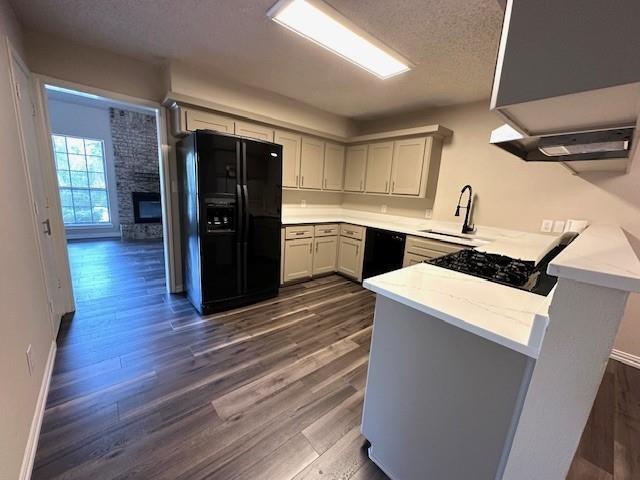 4119 Spring Meadow Lane Flower Mound, TX 75028 - Photo 9 of 28 a kitchen with a refrigerator and a stove top oven