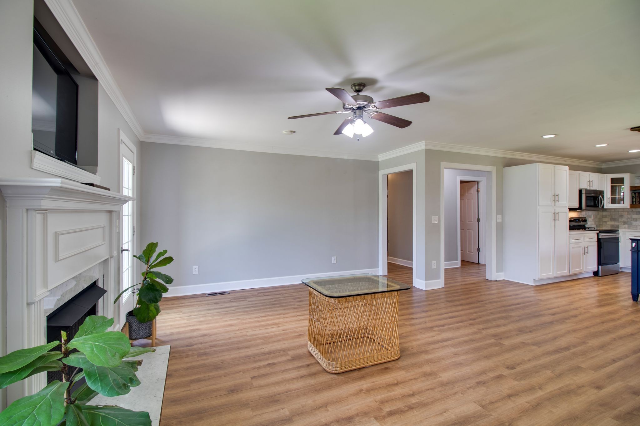1334 Davy Crockett Drive Murfreesboro, TN 37129 - Photo 11 of 45 a view of an empty room with wooden floor and a kitchen