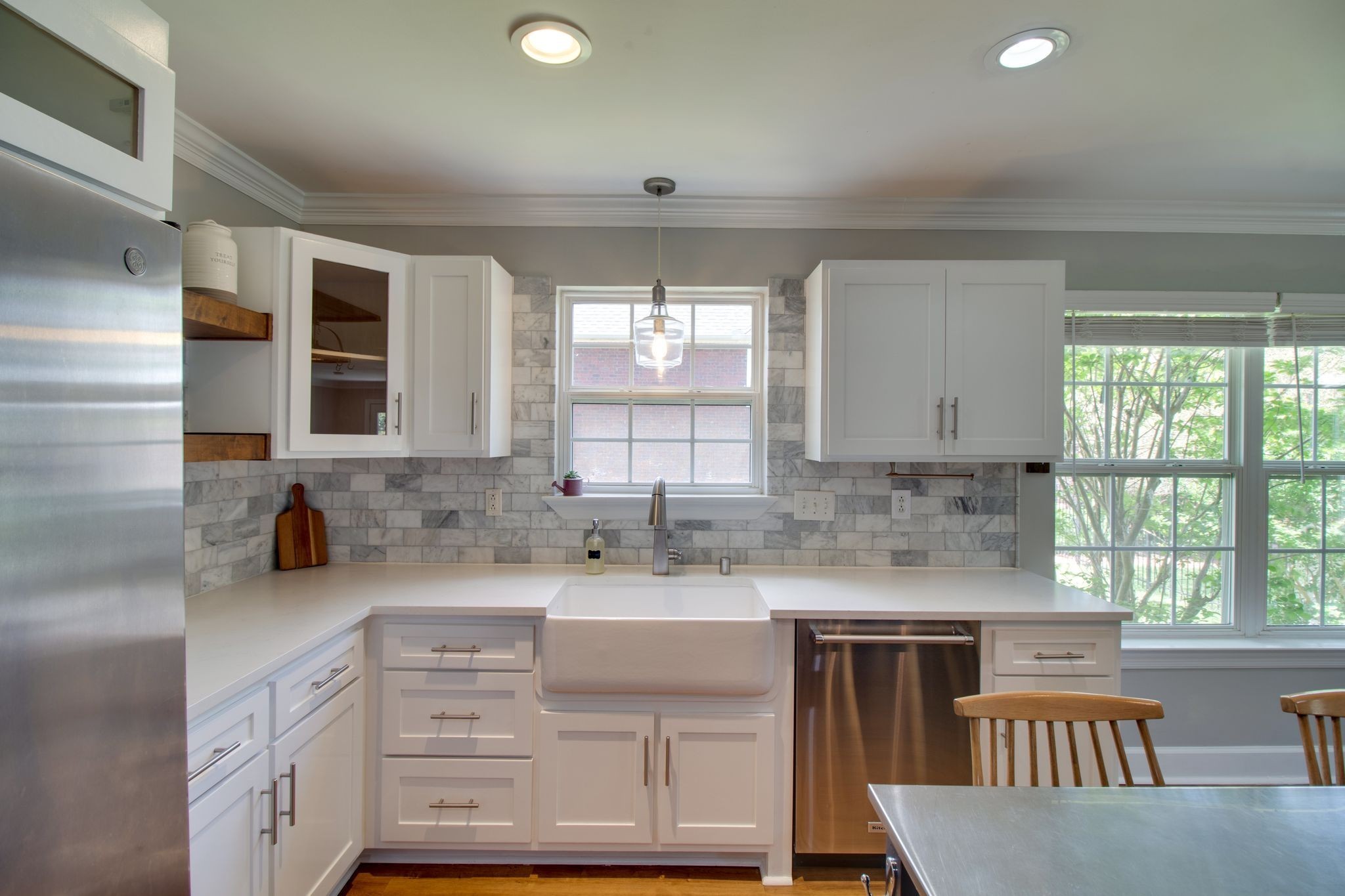 1334 Davy Crockett Drive Murfreesboro, TN 37129 - Photo 15 of 45 a kitchen with a stove a sink a microwave and cabinets