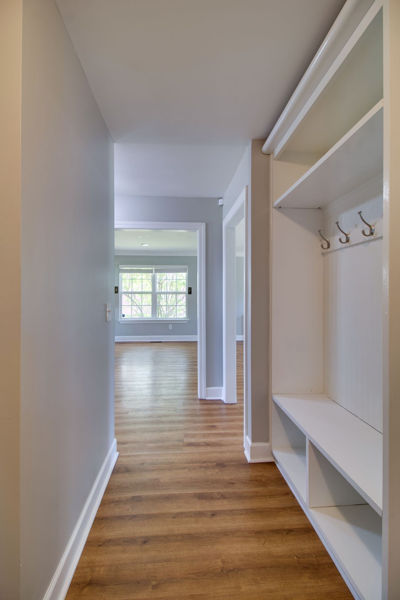 1334 Davy Crockett Drive Murfreesboro, TN 37129 - Photo 22 of 45 a hallway with wooden floor chandelier and front door