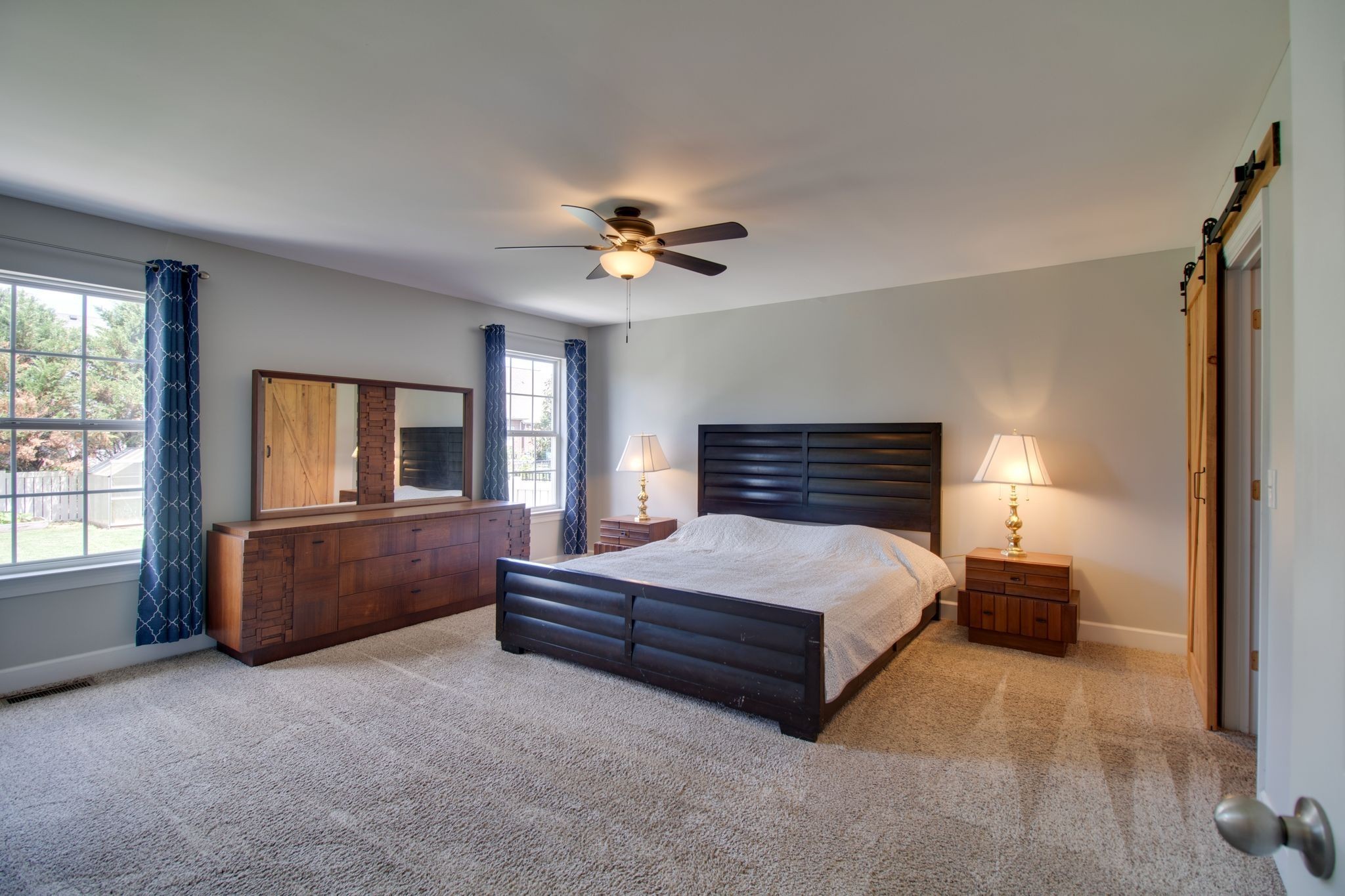 1334 Davy Crockett Drive Murfreesboro, TN 37129 - Photo 23 of 45 a spacious bedroom with a bed and a chandelier