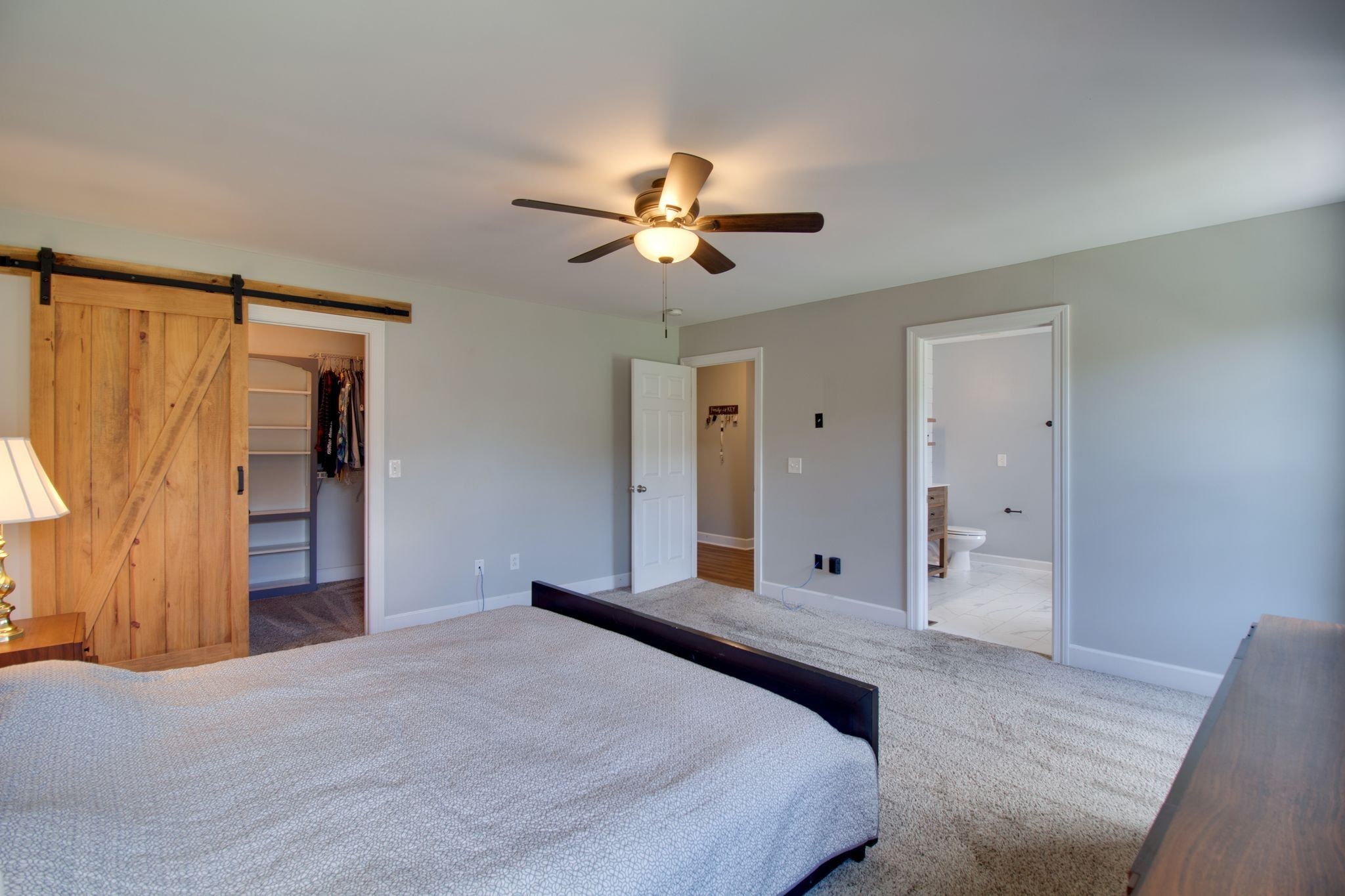 1334 Davy Crockett Drive Murfreesboro, TN 37129 - Photo 24 of 45 a bedroom with a bed and a chandelier