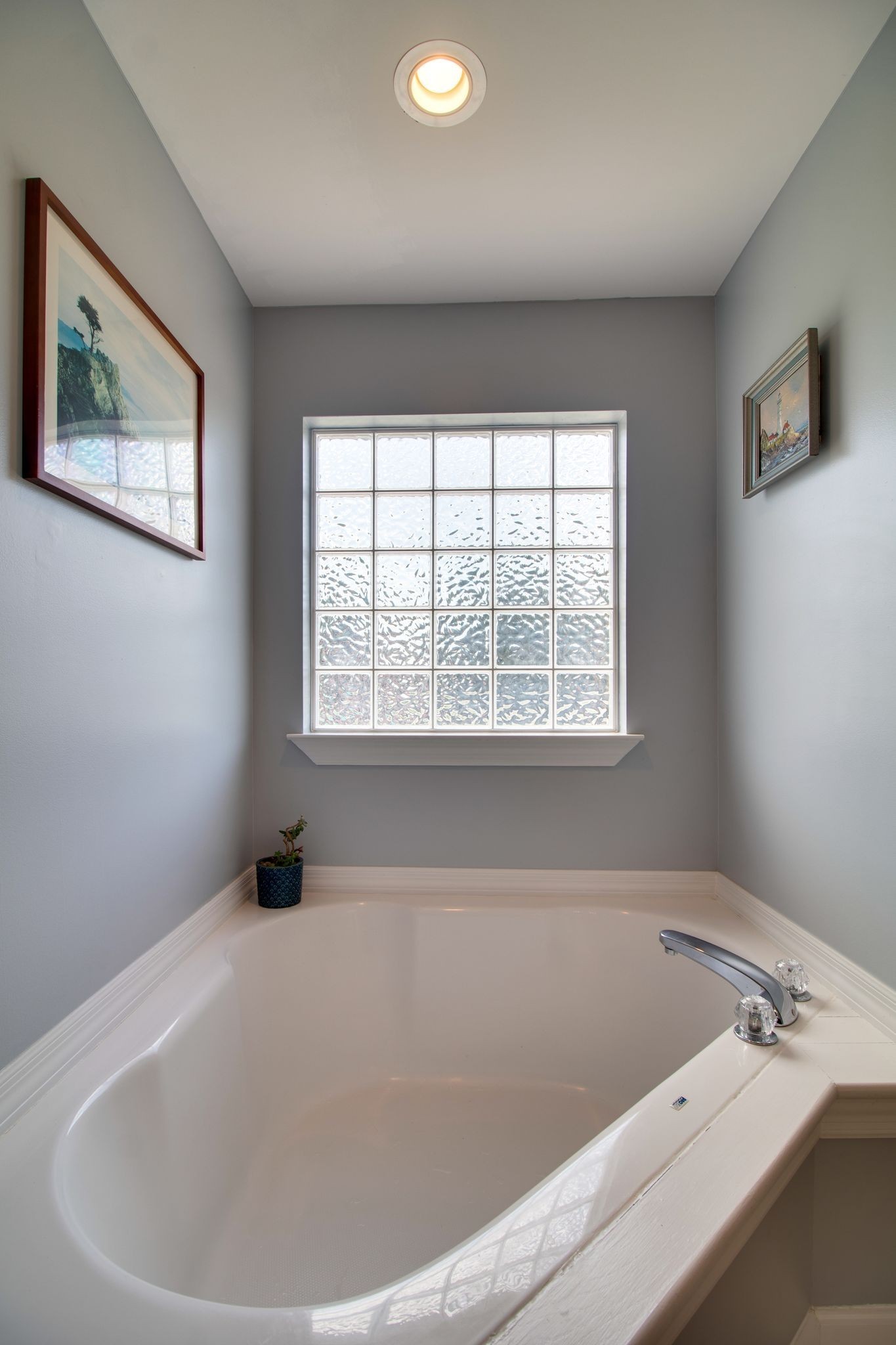 1334 Davy Crockett Drive Murfreesboro, TN 37129 - Photo 26 of 45 a white bath tub sitting in a bathroom next to a window