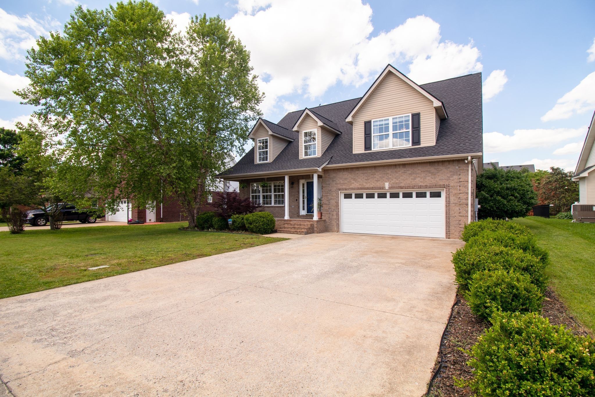 1334 Davy Crockett Drive Murfreesboro, TN 37129 - Photo 3 of 45 a front view of a house with a yard and garage