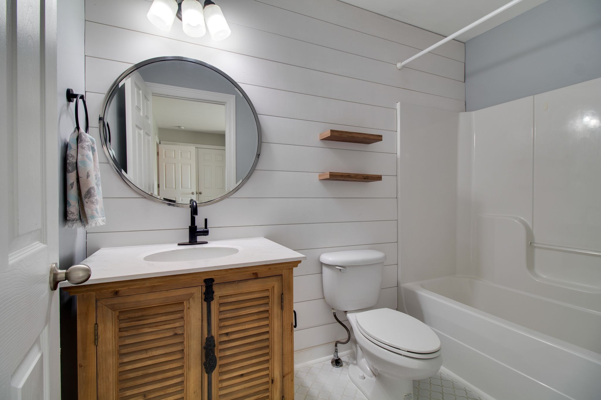 1334 Davy Crockett Drive Murfreesboro, TN 37129 - Photo 34 of 45 a bathroom with a toilet sink and mirror