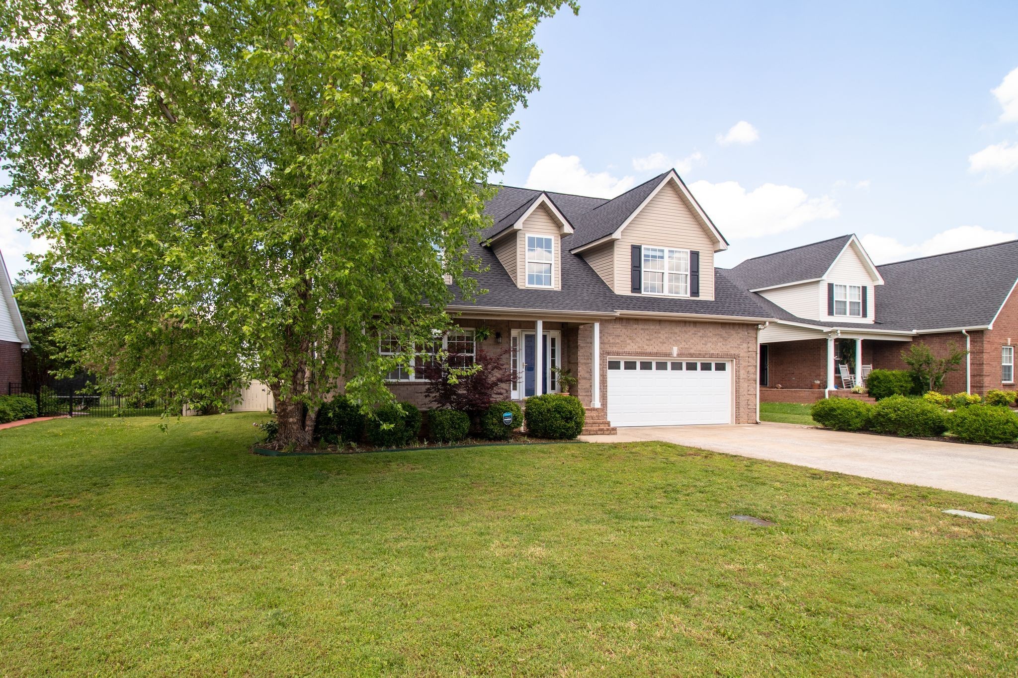 1334 Davy Crockett Drive Murfreesboro, TN 37129 - Photo 4 of 45 a front view of a house with a yard and garage