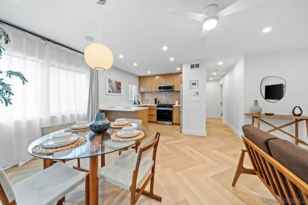 a view of a dining room with furniture and a table
