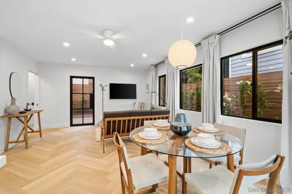 a view of a dining room with furniture window and outside view