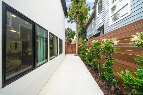 a view of a pathway both side of the house