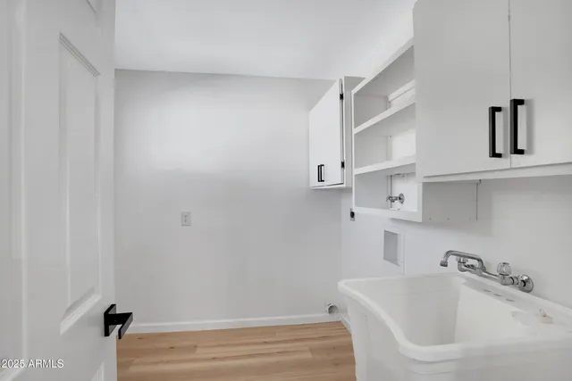 a bathroom with a sink toilet and tub