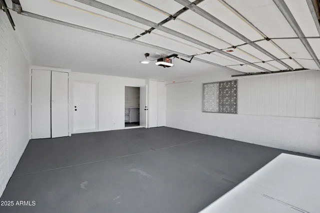 a view of a house with yard and sitting area