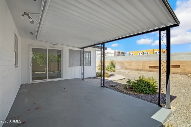a view of an entryway with a floor to ceiling window