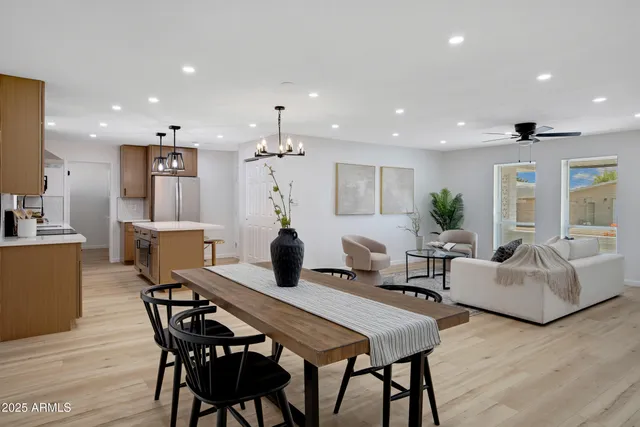 a kitchen with stainless steel appliances a sink stove refrigerator and cabinets