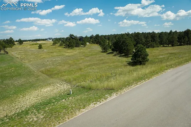 a view of a lake with a yard