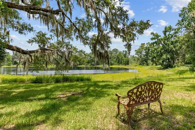 a view of a swimming pool with a table and chairs