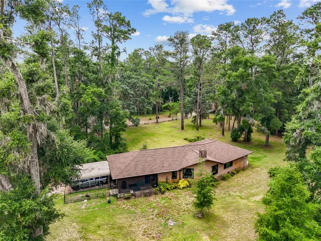 an outdoor space with furniture and garden view