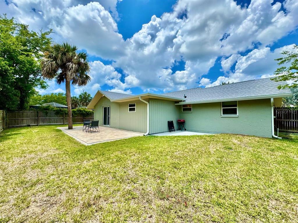 4282 Rudder Way New Port Richey, FL 34652 - Photo 32 of 34 a view of a house with swimming pool and a garden