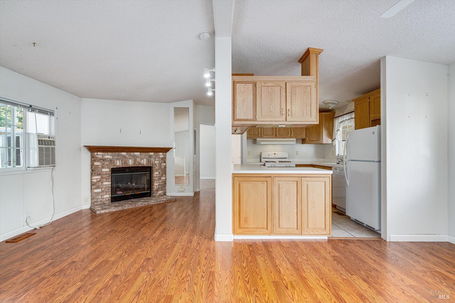 146 Westgate Circle Santa Rosa, CA 95401 - Photo 13 of 41 a kitchen with a refrigerator sink and cabinets